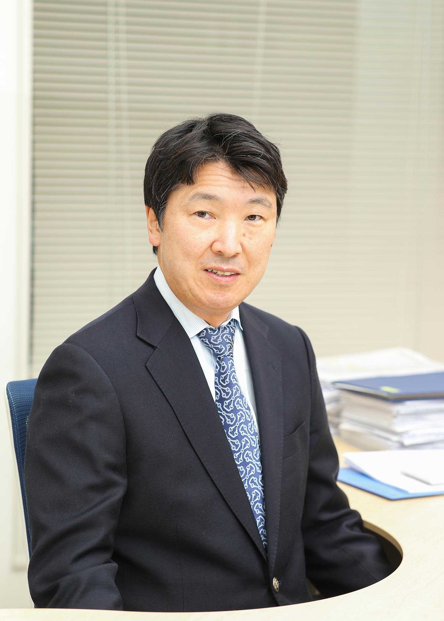 Kimio Mesuda at his desk