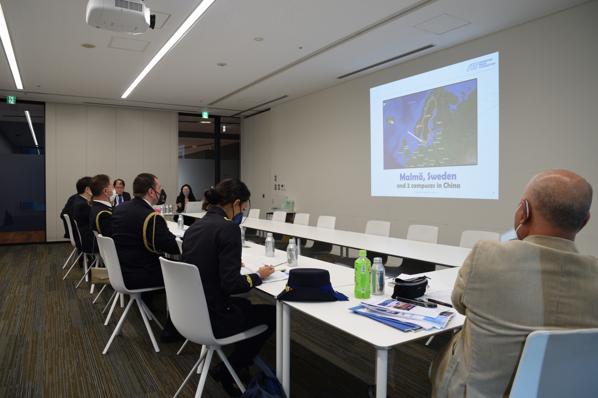 The delegation watching a presentation by OPRI