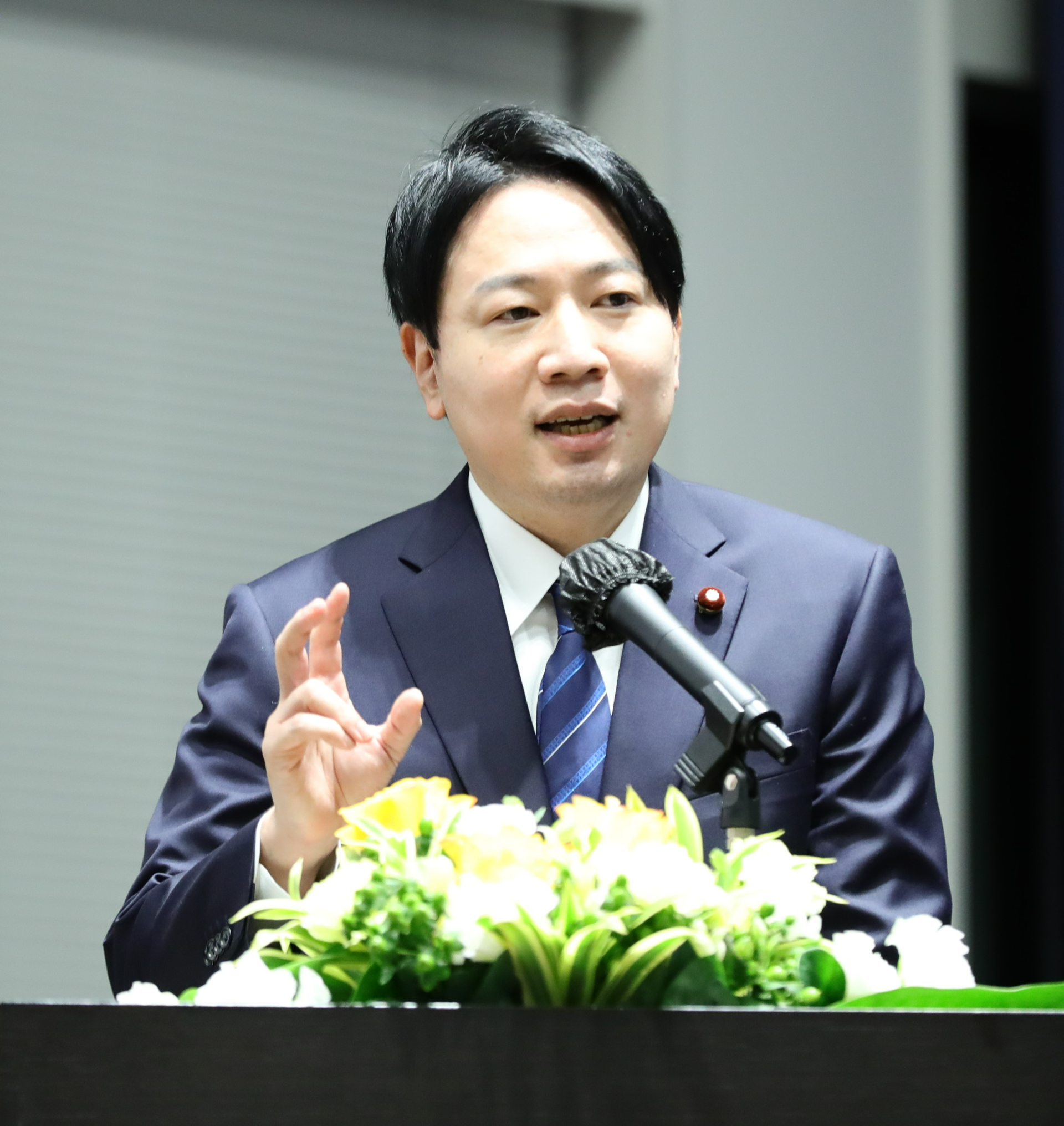 Japanese Minister Ogura at the podium