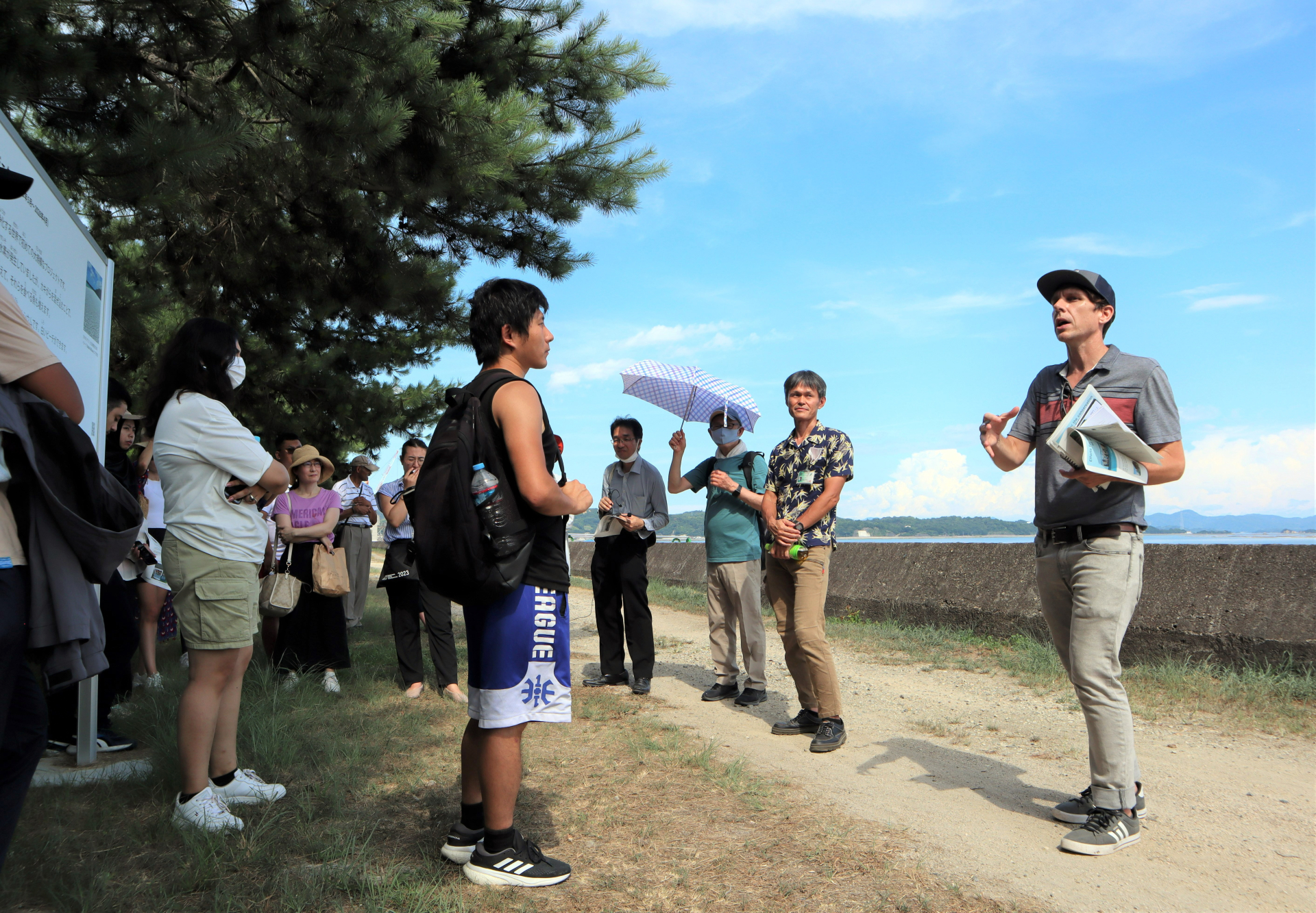 At Akitsu Bay, Dr. Fisher reflects with students about the relationship between ocean sustainability and oyster farming.