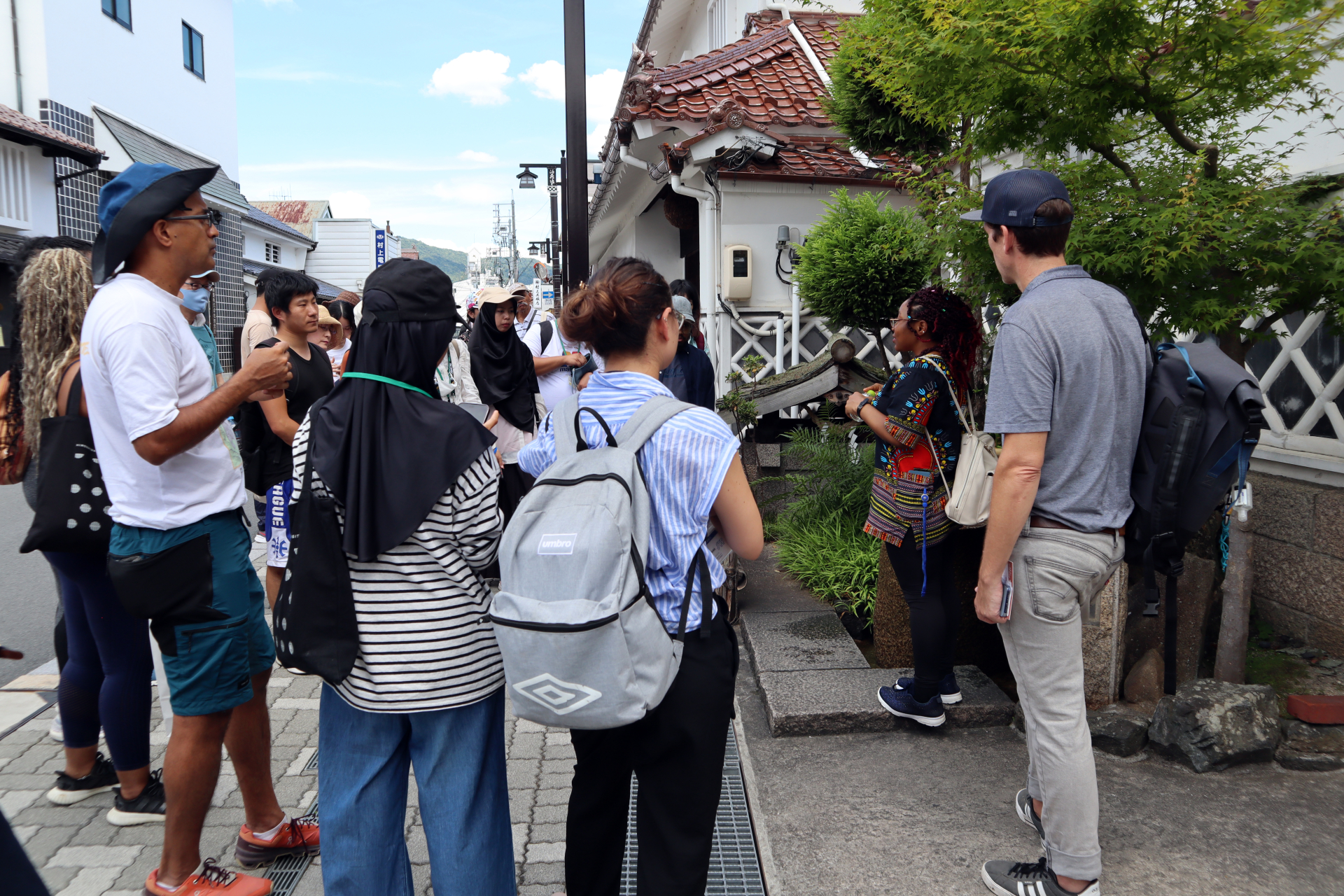 Students listen to an explanation about how water quality is maintained for sake production.