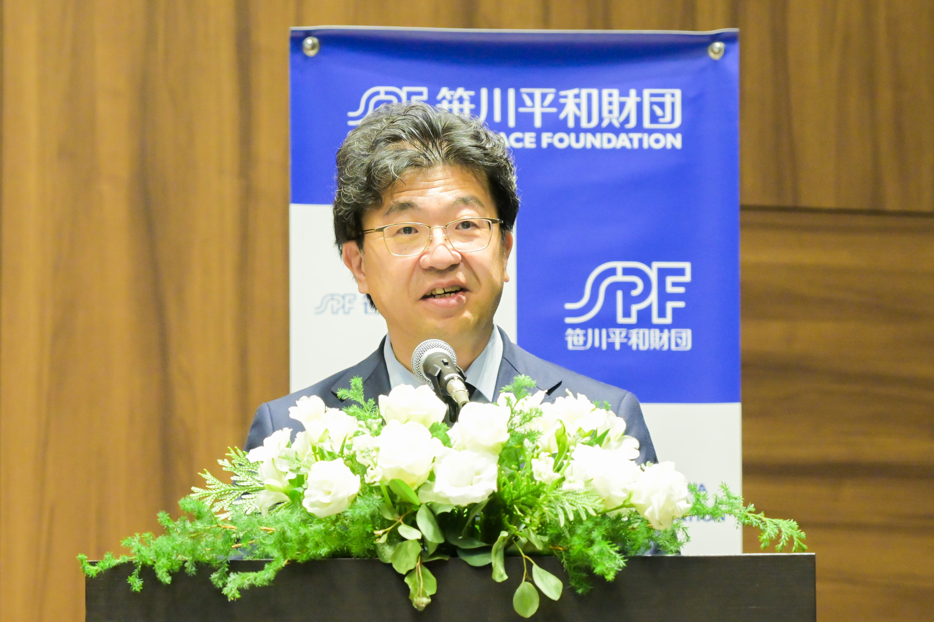 Dr. Sunami at the podium