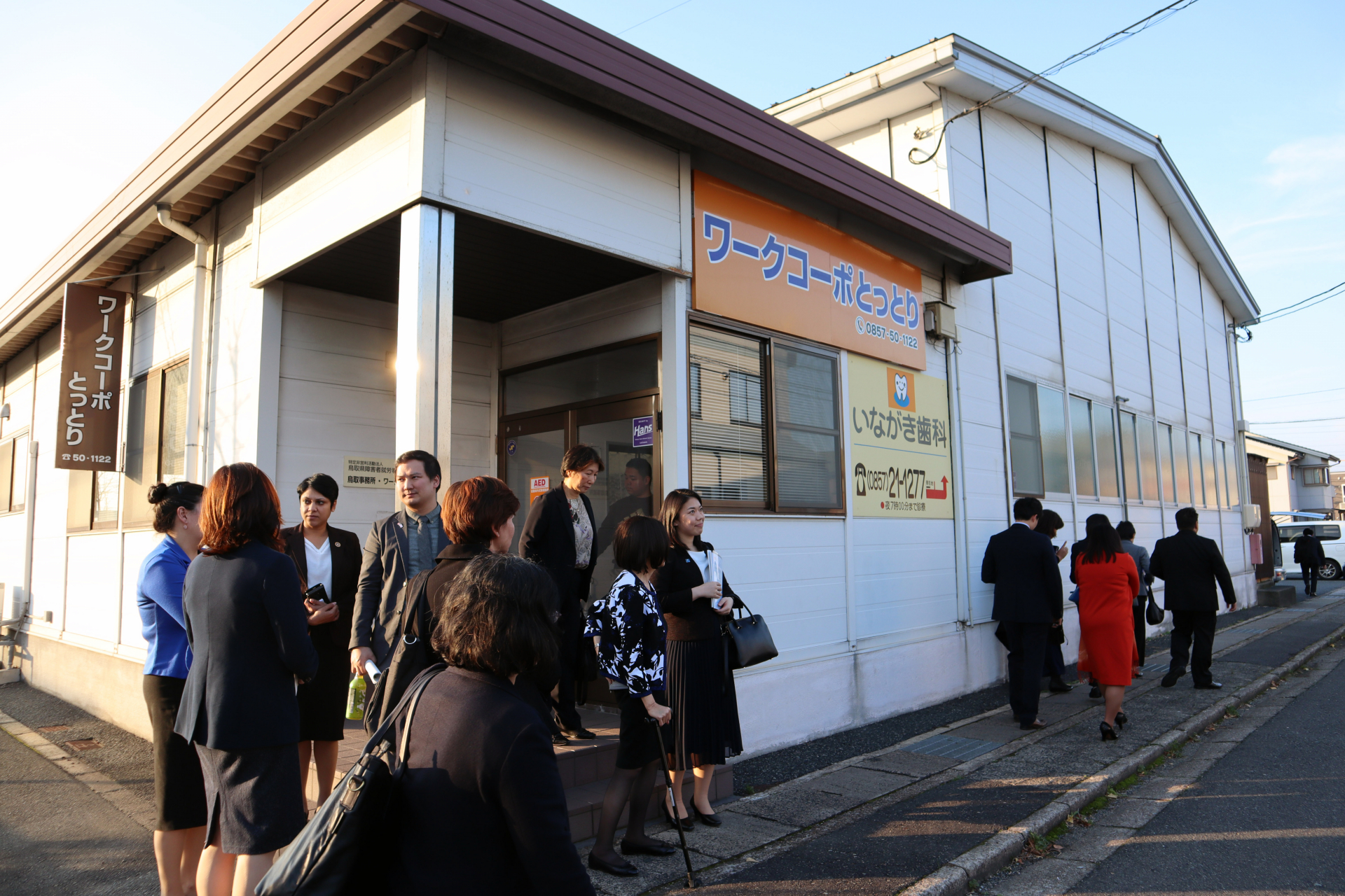 The delegation at Work Corpo Tottori, a packaging and distribution company providing work opportunities for people with disabilities