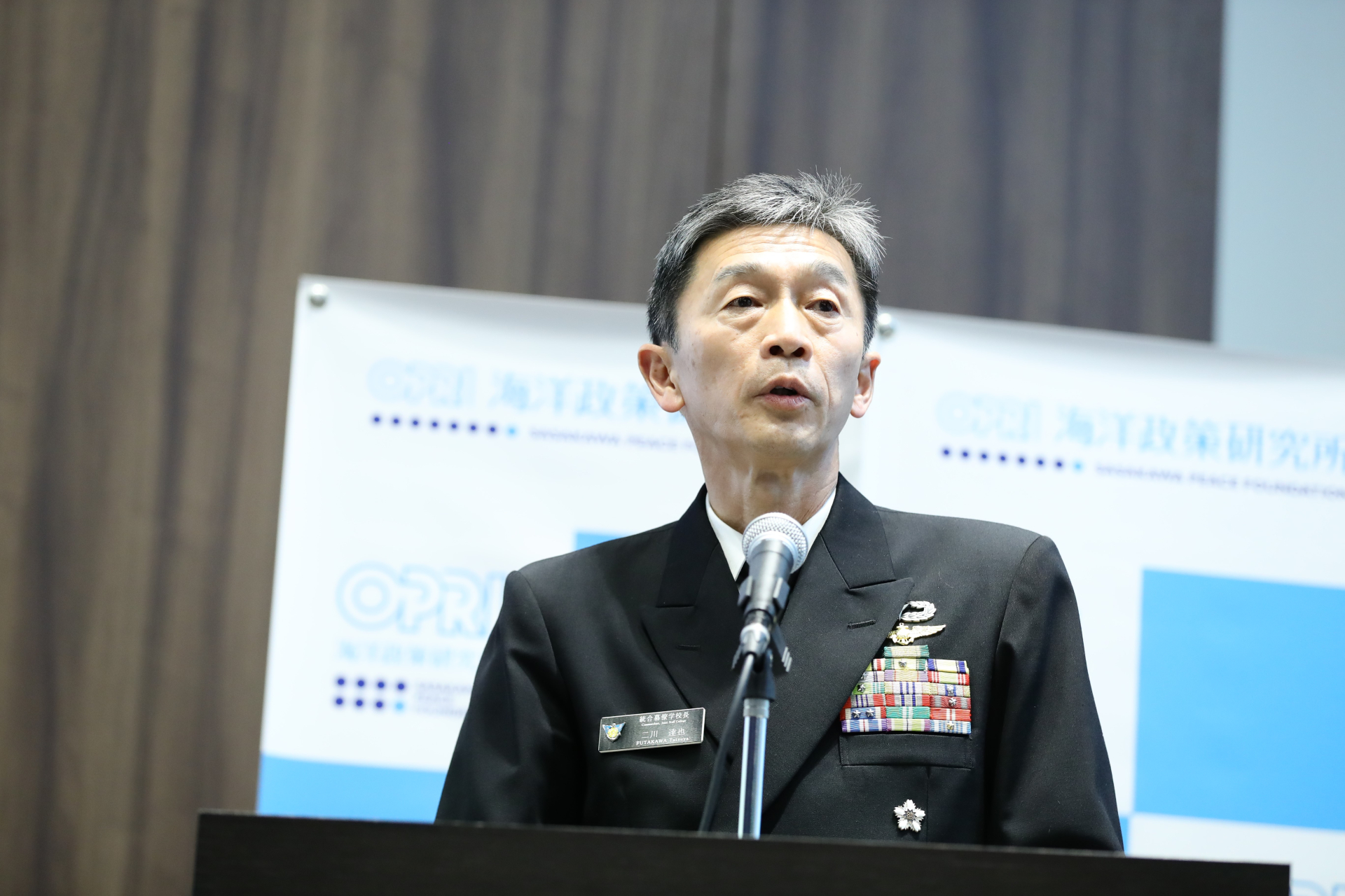 基調講演を行う二川達也・防衛省統合幕僚学校長